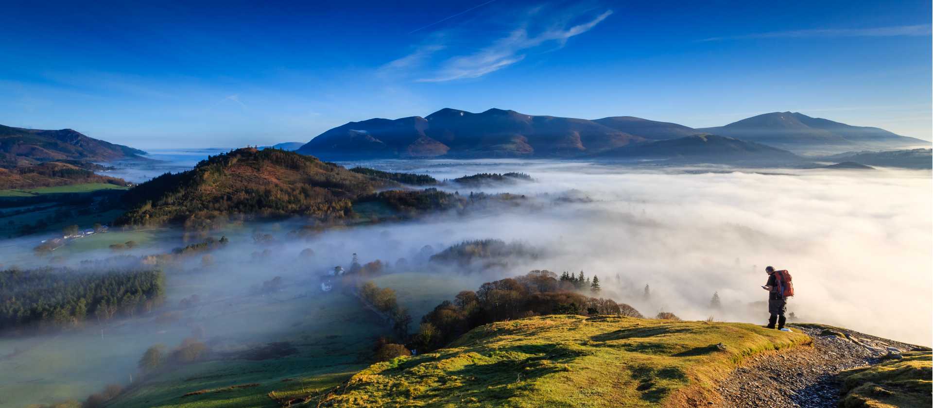 Fell walker ascending Catbells, The Lake District, Cumbria, England
 | Michael Conrad