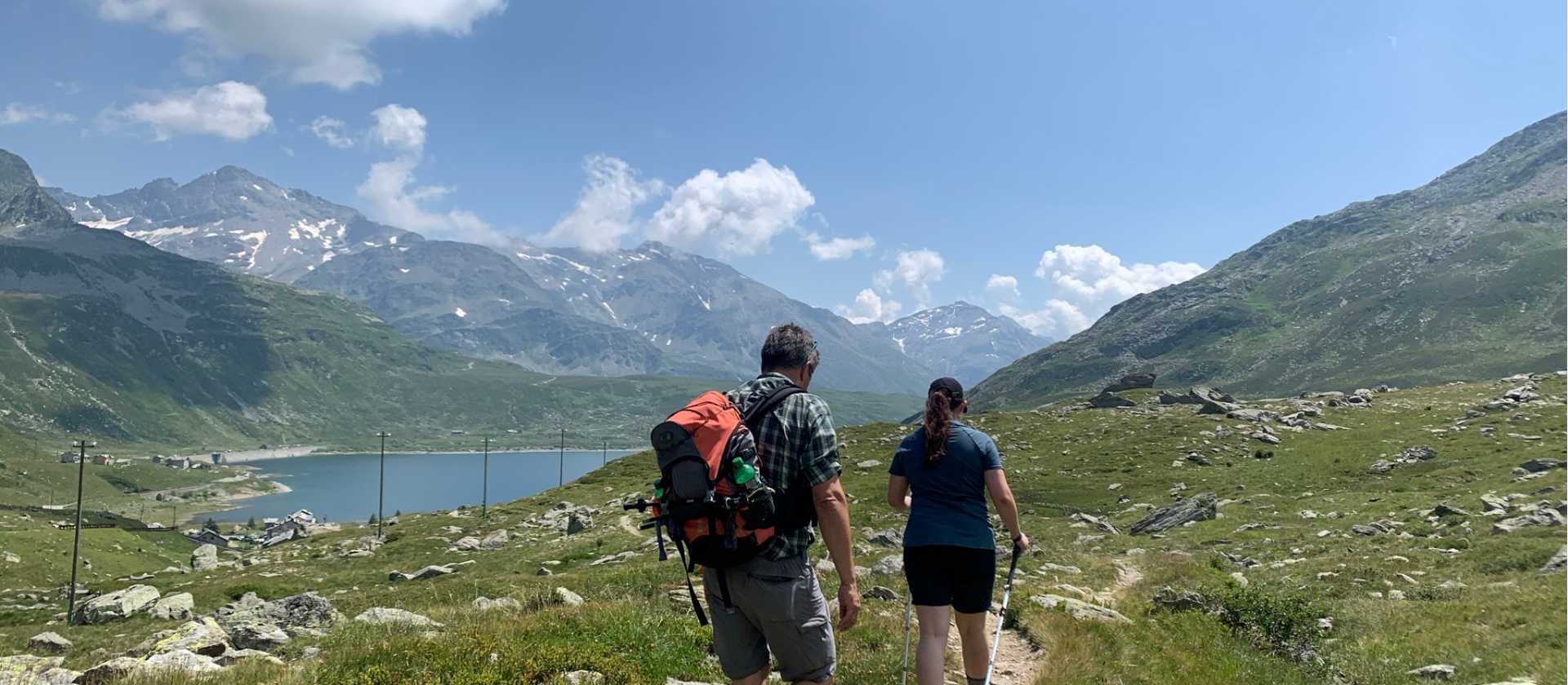 Hikers approaching Montespluga in the Italian Alps