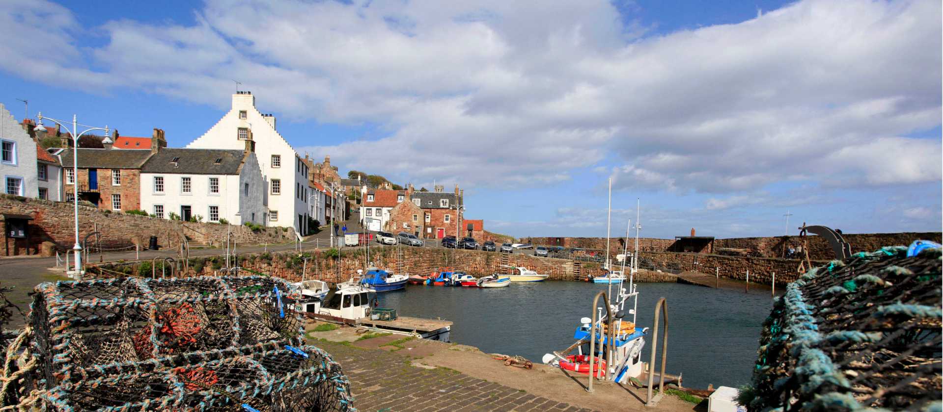 Reach lively Crail harbour on foot