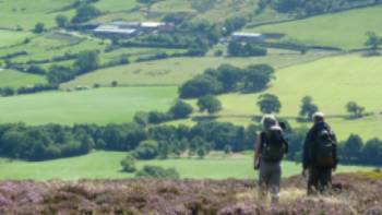 A couple enjoying the beautiful scenery on Wainwright's Coast to Coast