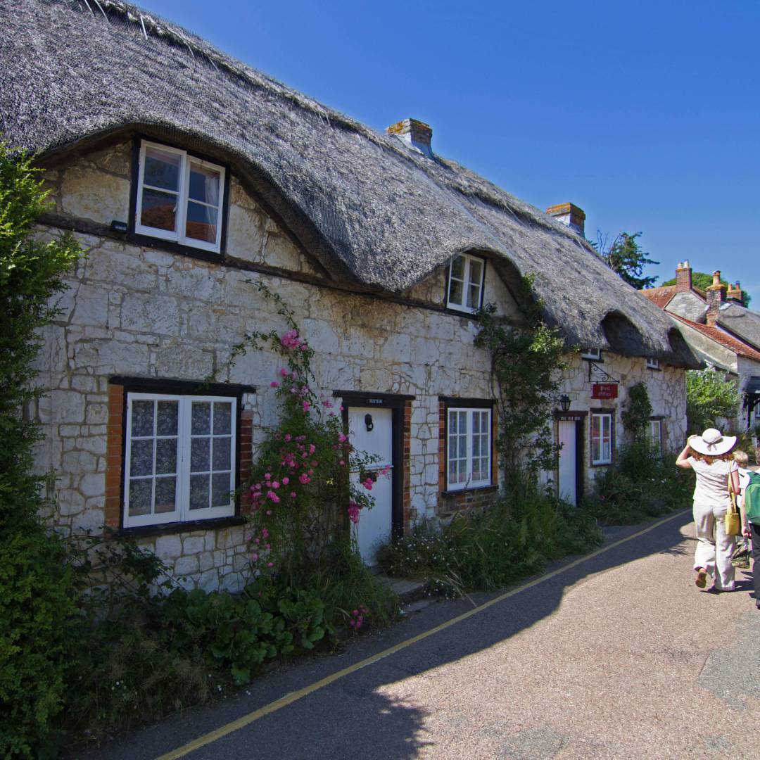 Walkers on the street in charming Brighstone Village, Isle of Wight | visitisleofwight.co.uk