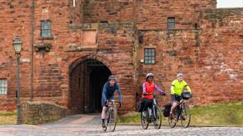 Carlisle,Carlos Reina Cyclists riding near Carlisle Castle