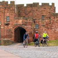 Cyclists riding near Carlisle Castle | Carlos Reina