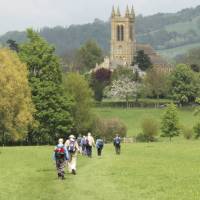 A group of walkers arrives in Broadway in the Cotswold