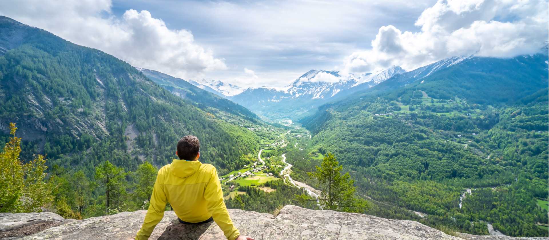 A hiker taking in the sweeping alpine views of Écrins National Par | Guillaume Galvani