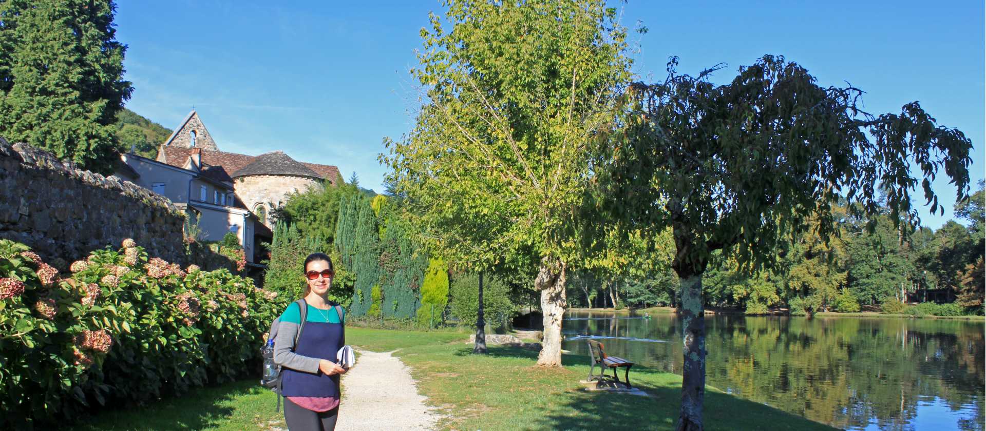 A walker on the towpath beside the Dordogne River in Beaulieu-sur-Dordogne | Nathalie Thomson
