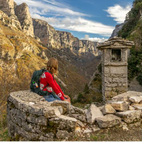 A hiker looking into the Vikos Gorge