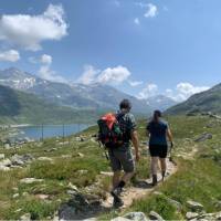 Hikers approaching Montespluga in the Italian Alps