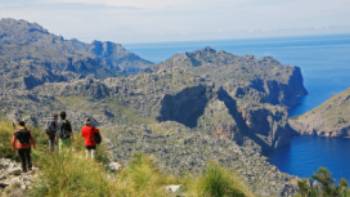 Hikers walking along Mallorca's coastal paths to Cala Codolar and El Murteret