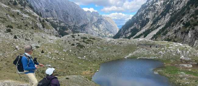 Hikers absorbing the view on the Peaks of the Balkans trail in Albania | Kate Baker