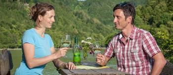 A couple relaxing after a days' cycling by the Danube