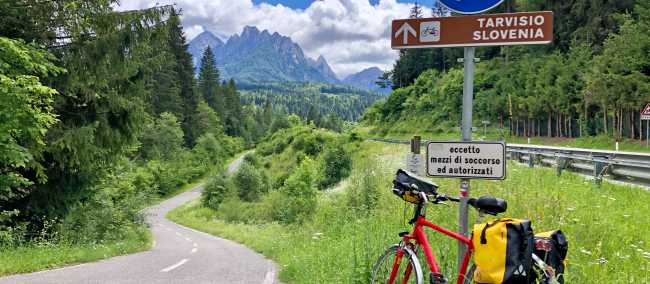 Cyclist on the Alpe Adria route outside Tarvisio Italy