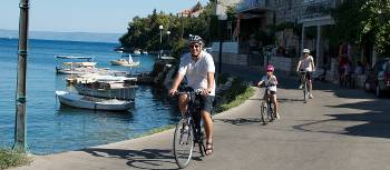 Cycling past boats on the Croatian islands with kids | Ross Baker
