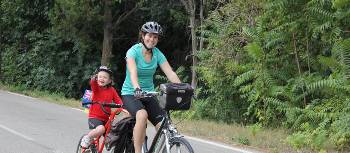 Cycling with a child using a trailer bike is an ideal way to explore the backroads of Provence | Phil Wyndham