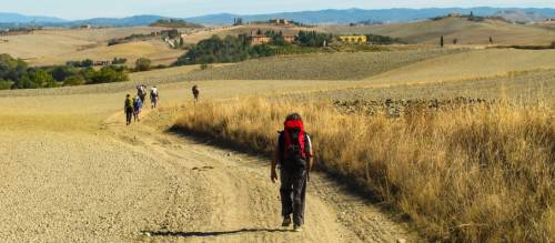 Pilgrims making their way towards Rome on the Via Francigena