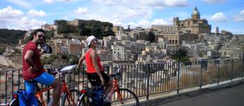 Cyclists take in the view in Sicily