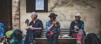 Pilgrims eating lunch on the Via Francigena | Tim Charody