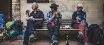 Pilgrims eating lunch on the Via Francigena | Tim Charody