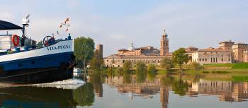 Travel past authentic Italian villages by bike or boat in the Veneto region