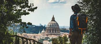 Pilgrim walking into St Peters in Rome at the end of the Via Francigena | Tim Charody