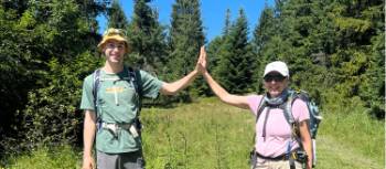 Hikers high-fiving | Kate Baker
