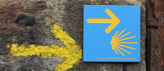 Portuguese Camino sign showing the way to Santiago de Compostela in Spain | Jaclyn Lofts