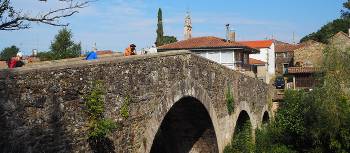 The ancient arched bridge leading pilgrims into Melide | Sue Finn