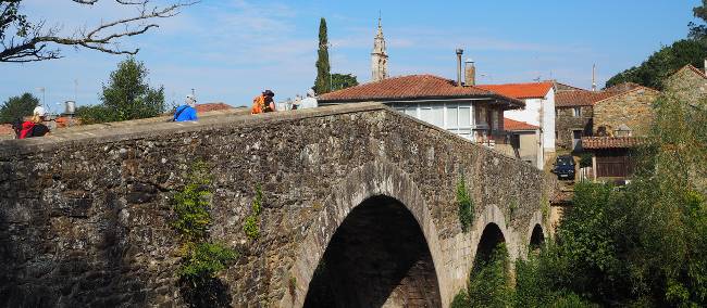 The ancient arched bridge leading pilgrims into Melide | Sue Finn