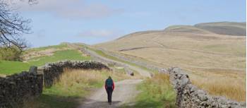 A hikers ascending Great Shunner Fell | John Millen