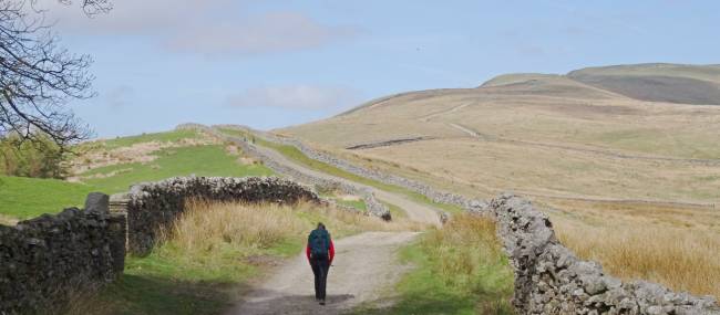 A hikers ascending Great Shunner Fell | John Millen